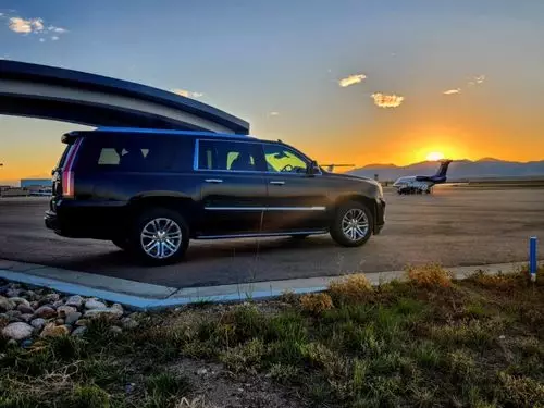 Black SUV Background Sunset