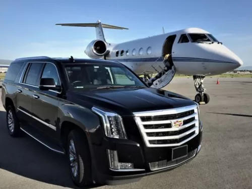 SUV at Centennial Airport (APA) with Private Jet Plane